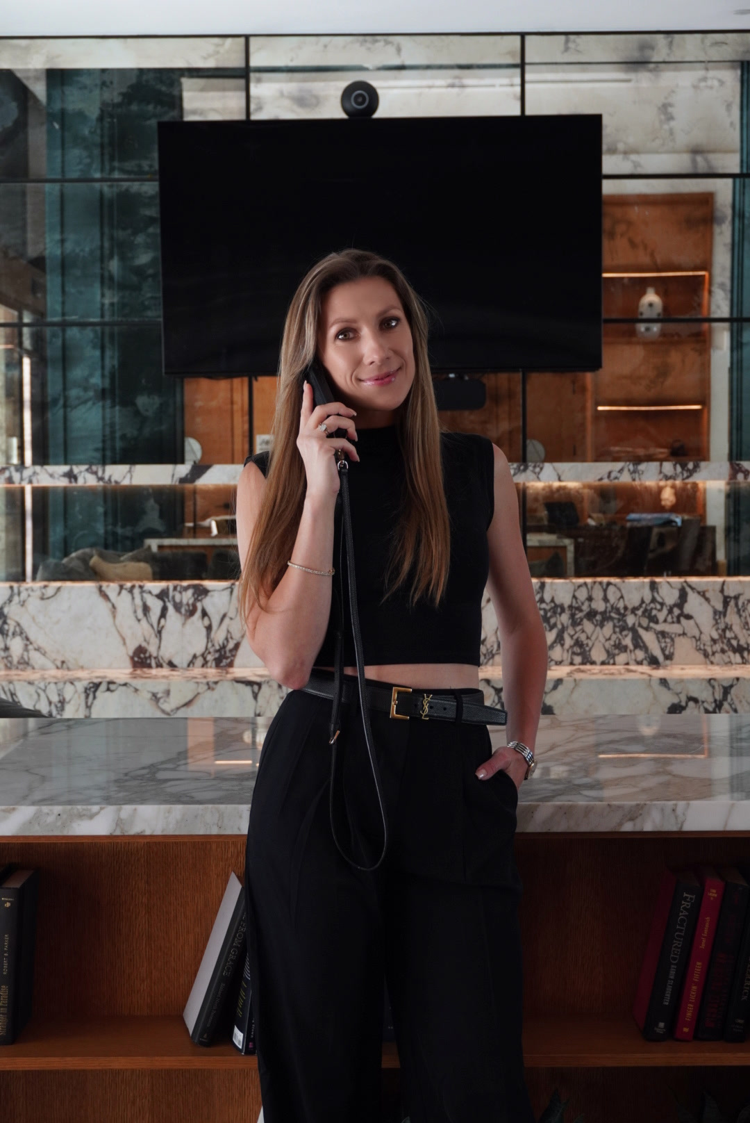 Viktoryia on a phone call in a warm editorial setting.